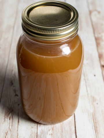 finished quart of homemade chicken stock