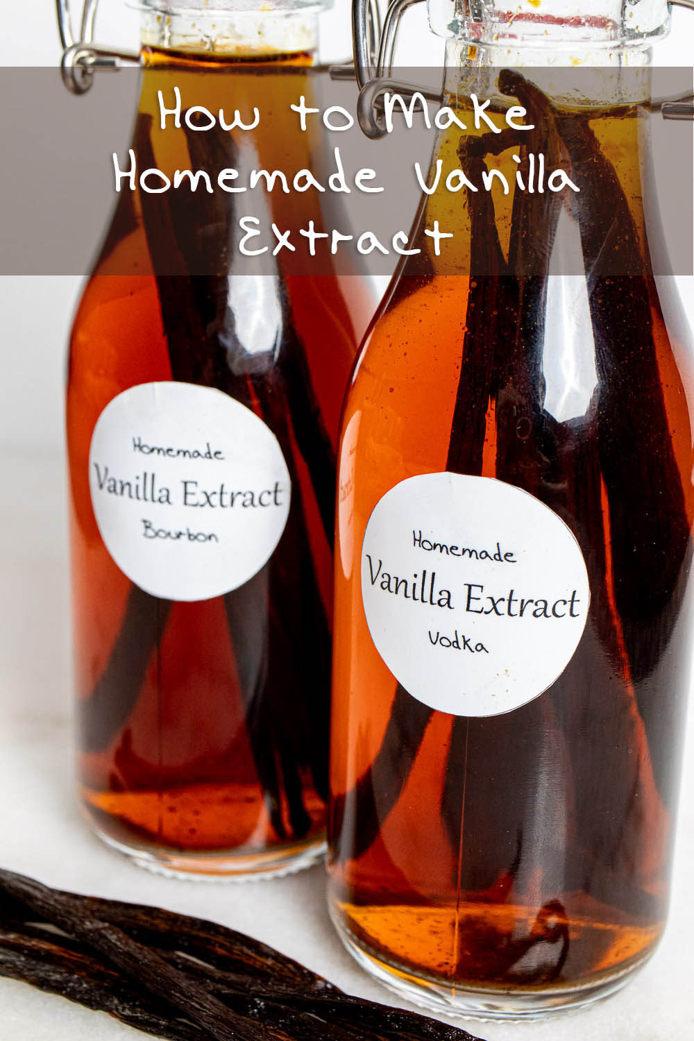 two swing top bottles of homemade vanilla extract close up