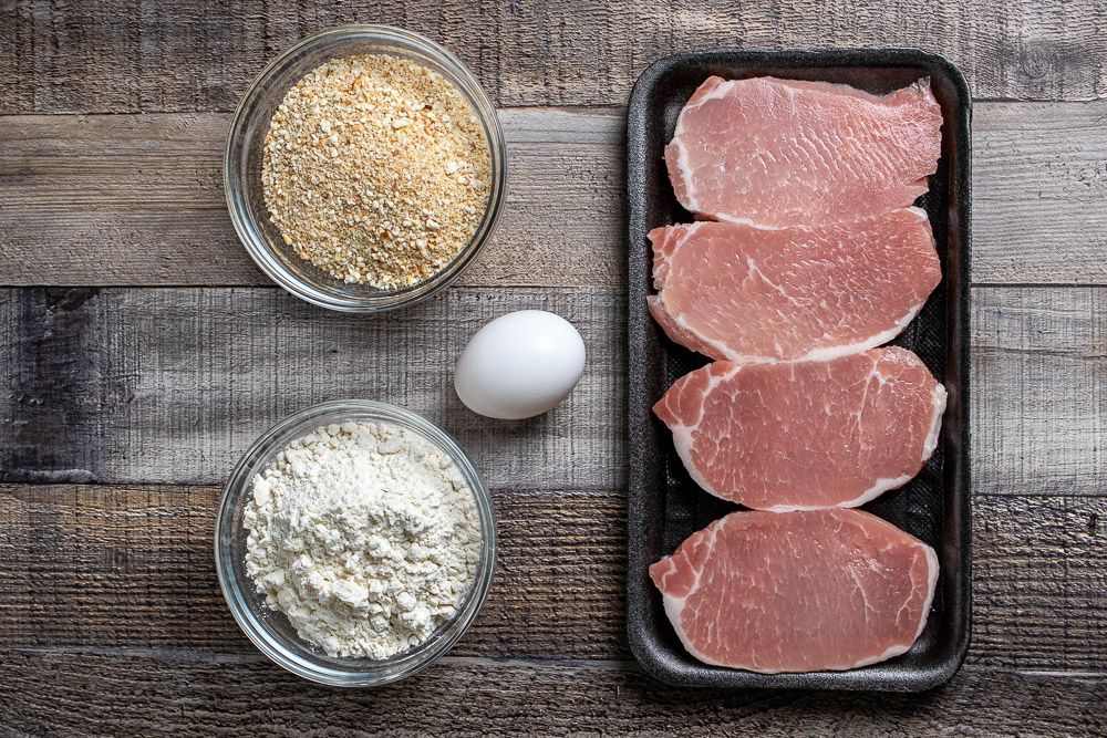 pork chops, flour, egg, and breadcrumbs for jagerschnitzel
