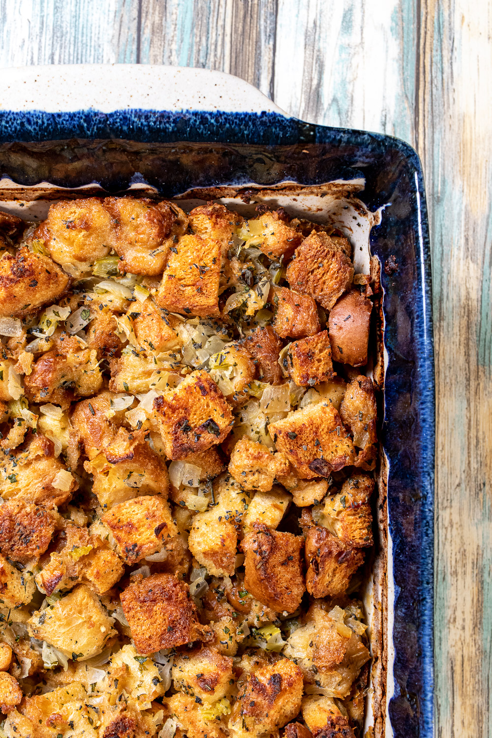 classic Thanksgiving stuffing in a blue and white baking dish