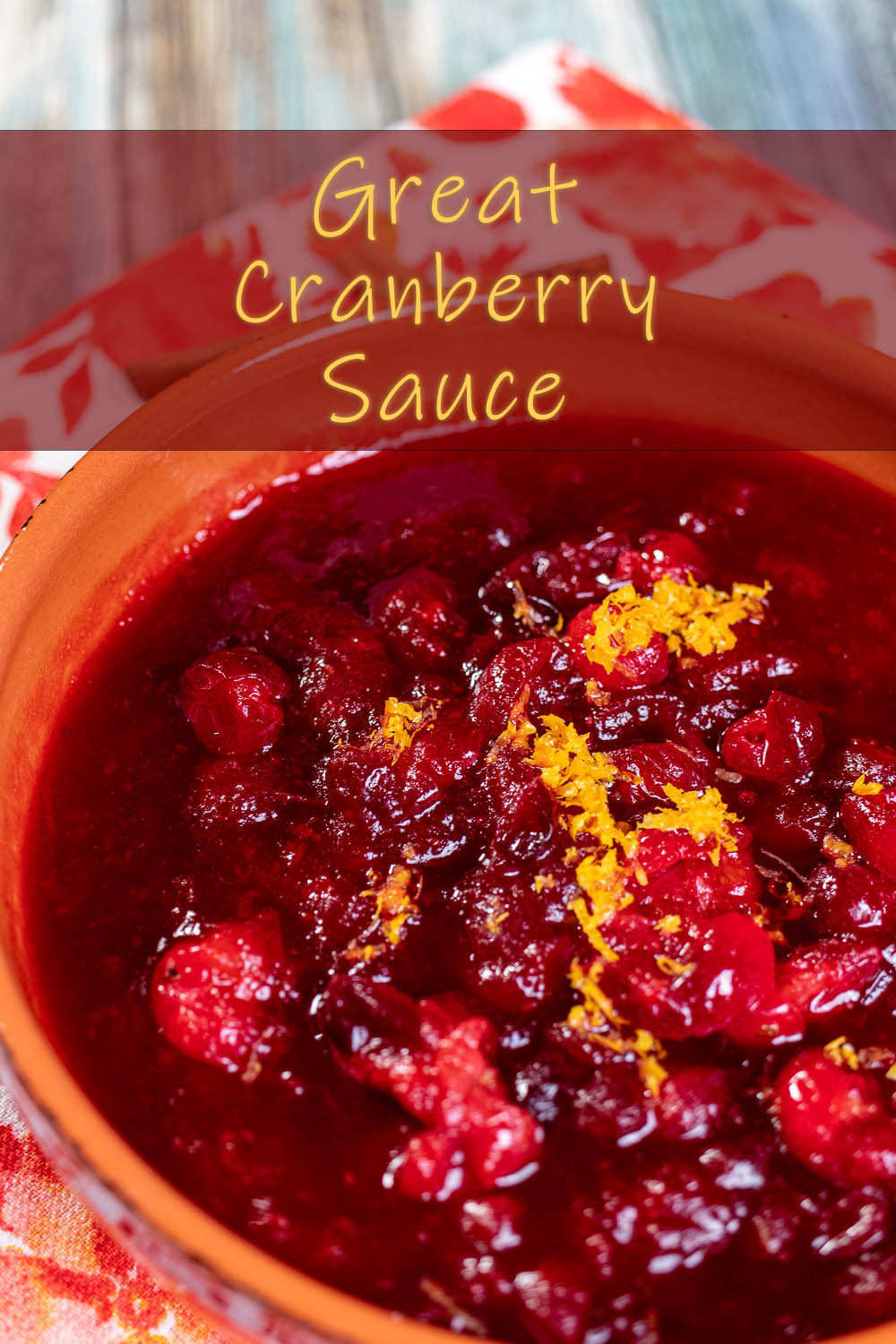 close up of cranberry sauce with orange zest on top in an orange bowl