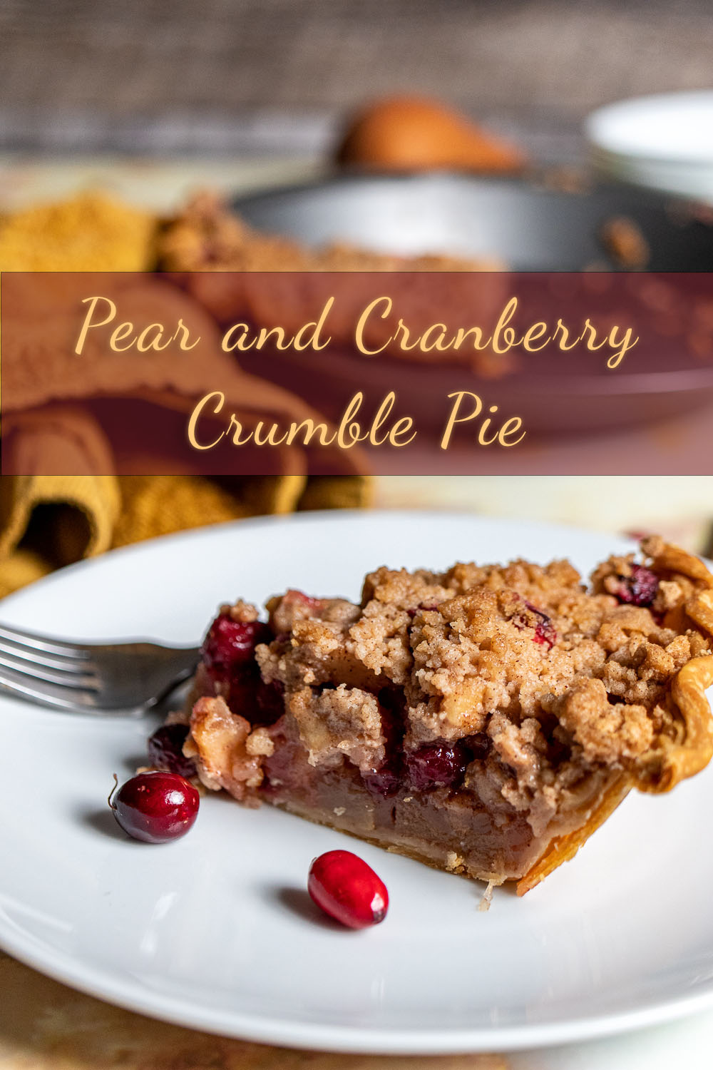 slice of cranberry pear crumble pie on a white plate with pie in background