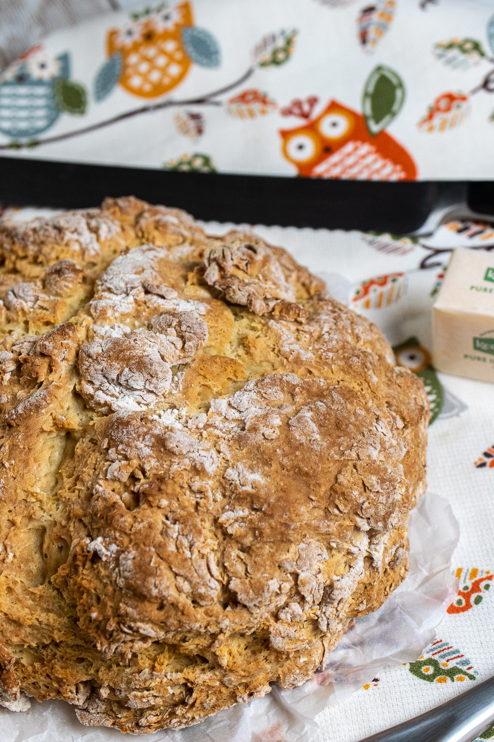 traditional Irish soda bread with a bread knife and Irish butter