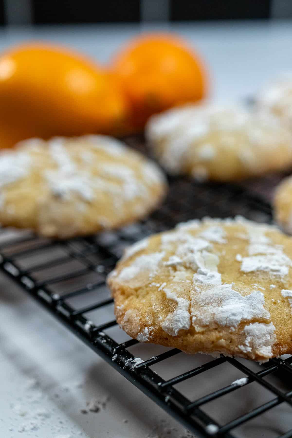 Meyer lemon crinkle cookies cooling on a cookie rack.