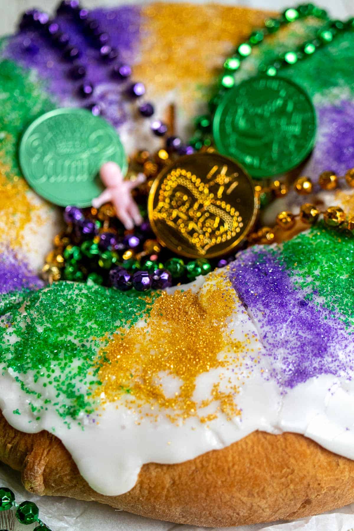 Overhead view of the side and middle of a New Orleans king cake.