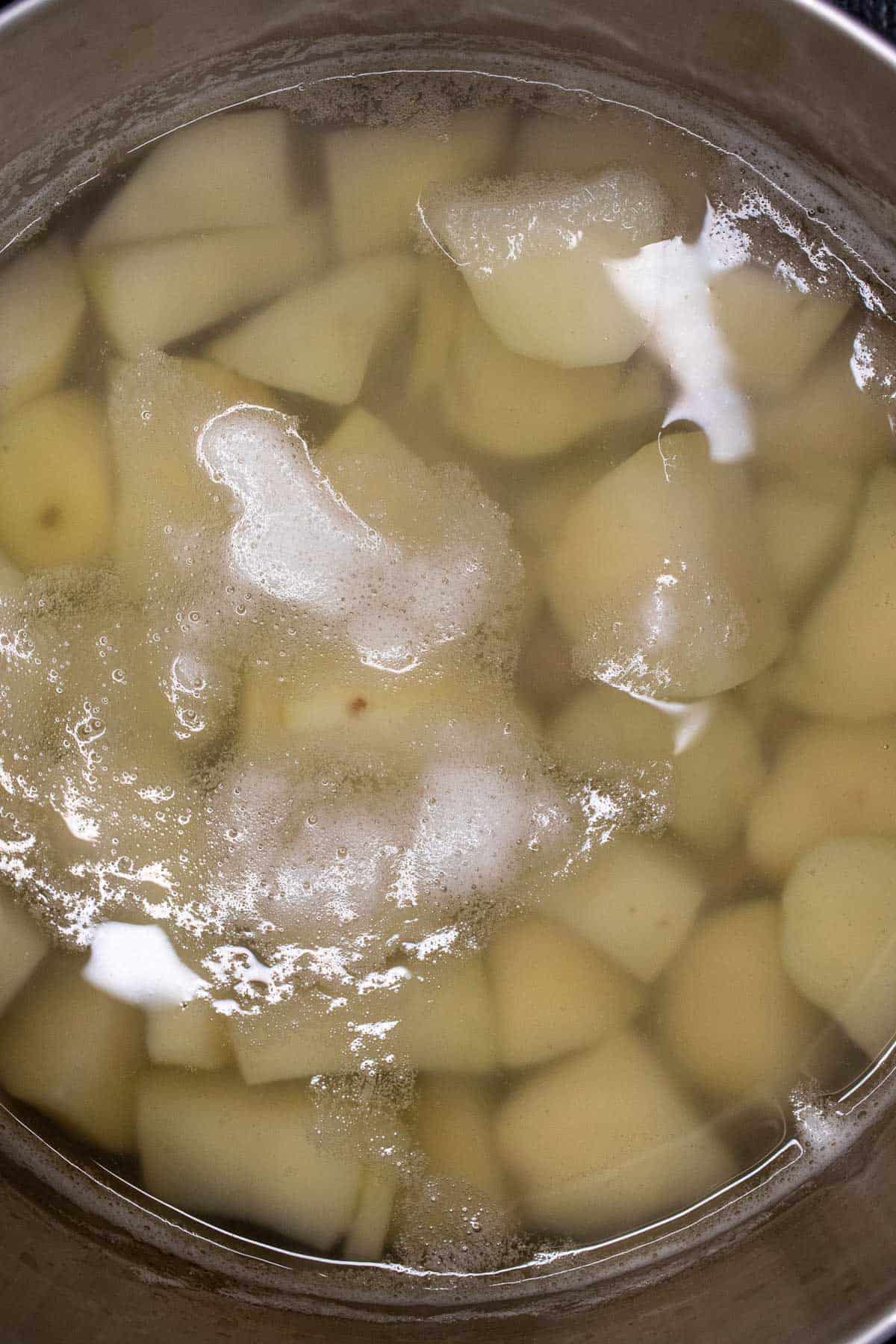 Potatoes par boiling in salted water.