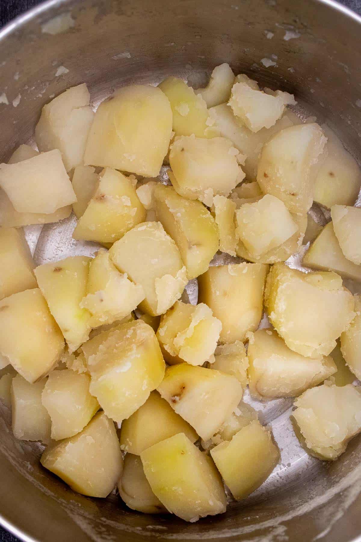 Cooked potatoes in hot pot to cook off excess water.
