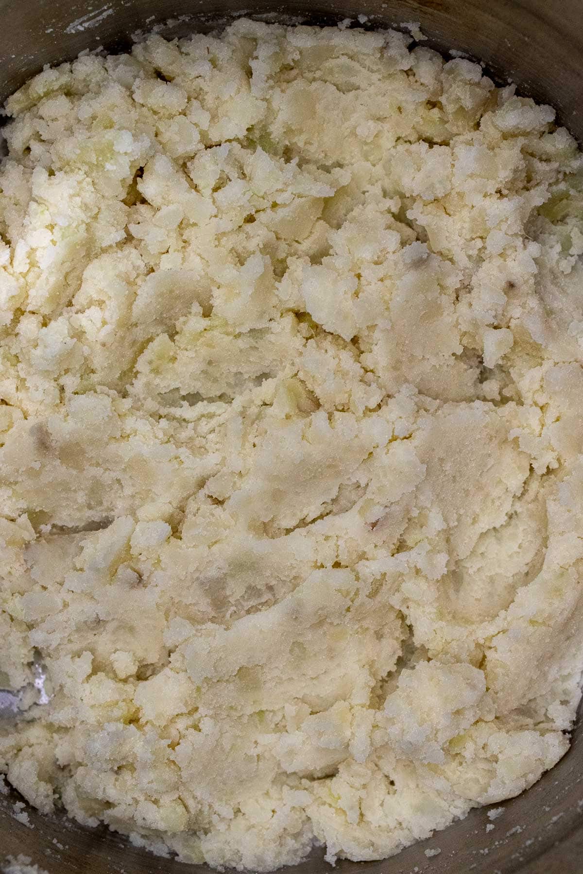 Potatoes mashed inside a pot.