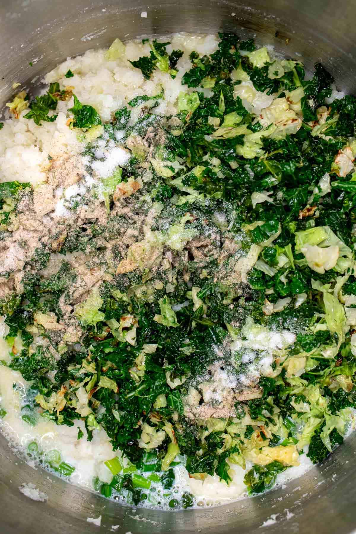 Cabbage, kale, salt, pepper, and scallion-onion mixture added to the mashed potatoes.