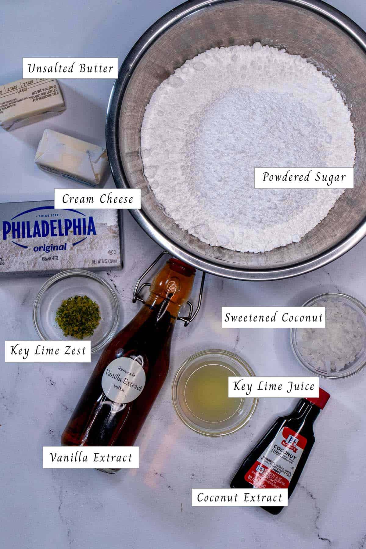 Ingredients for making key lime coconut cream cheese frosting.
