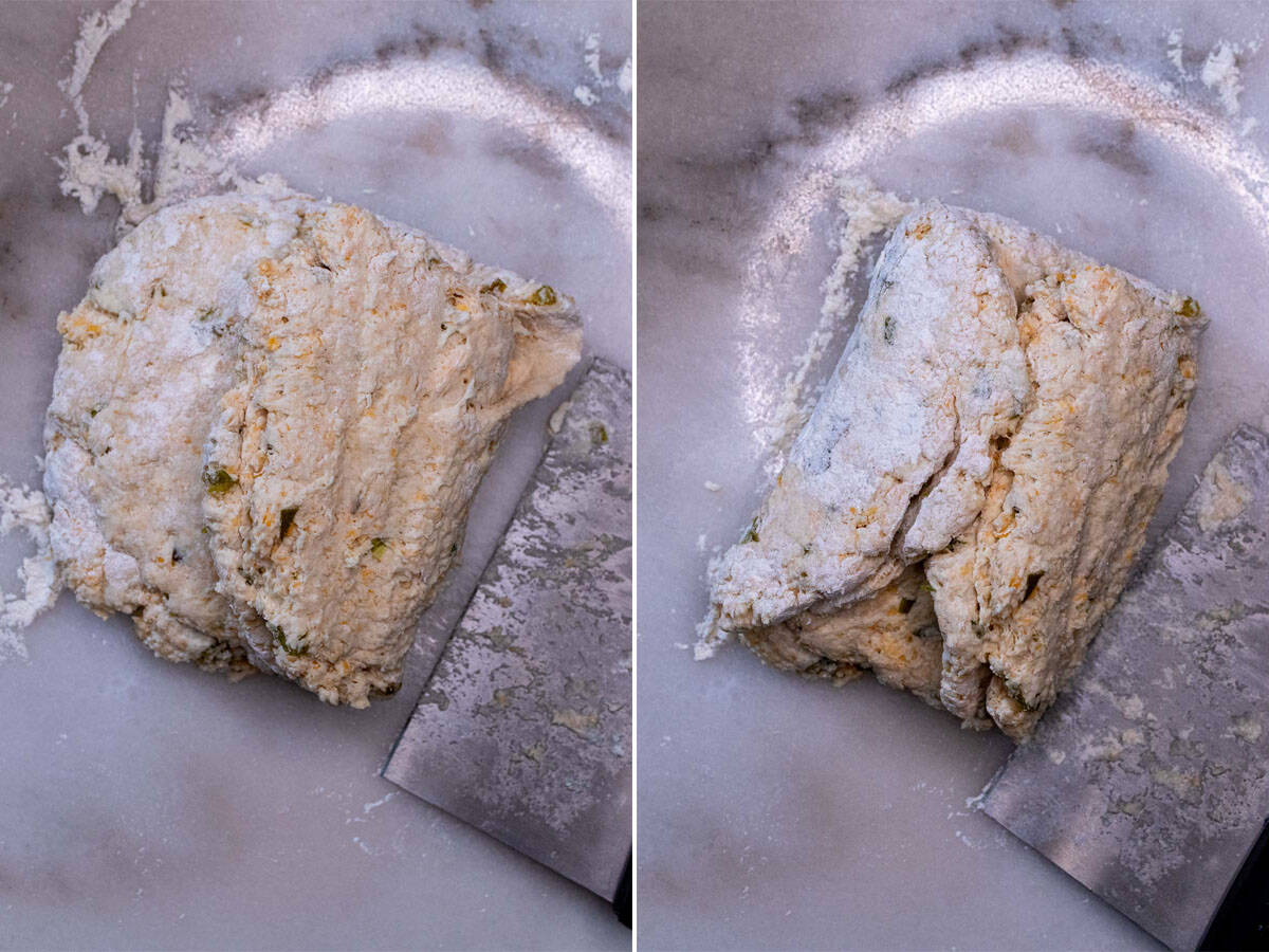 Biscuit dough being laminated with book fold method.
