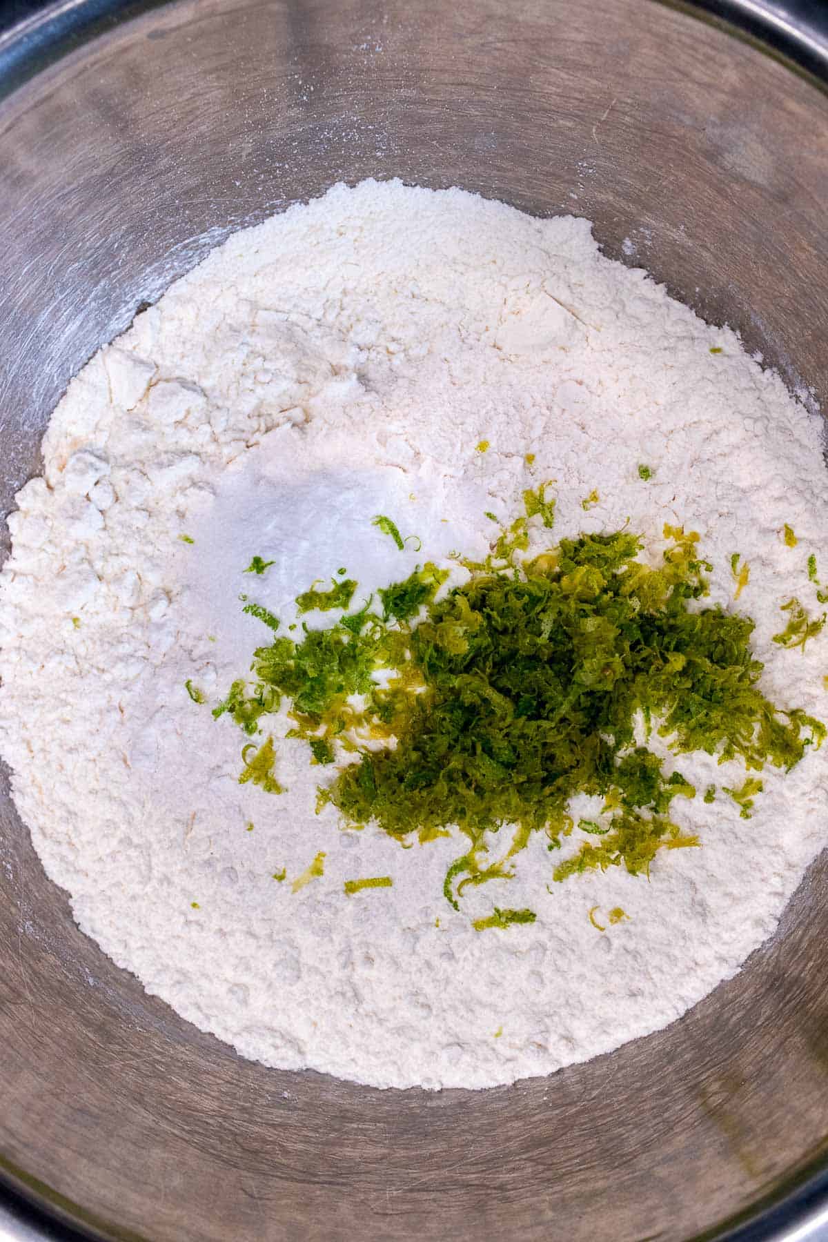 Mixing dry ingredients for key lime cookies.
