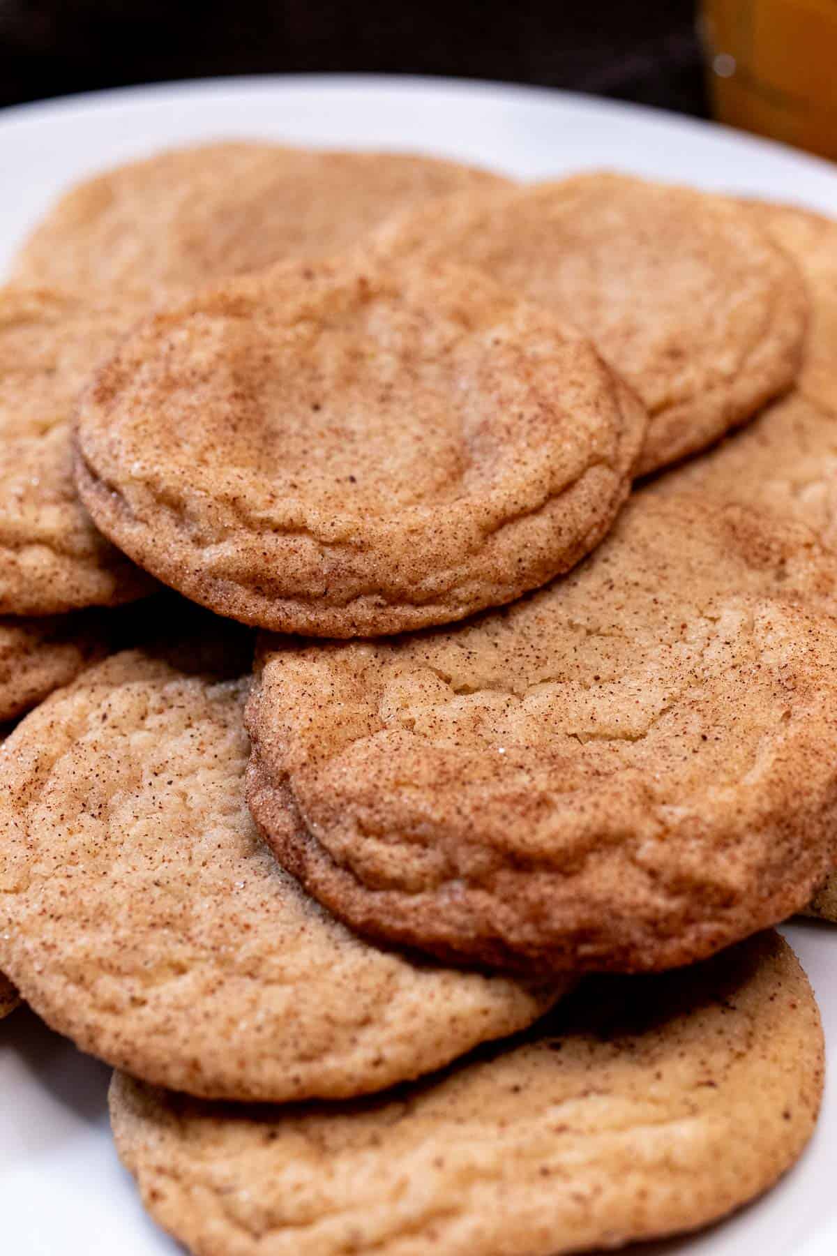 Apple cider snickerdoodle cookies on a plate.