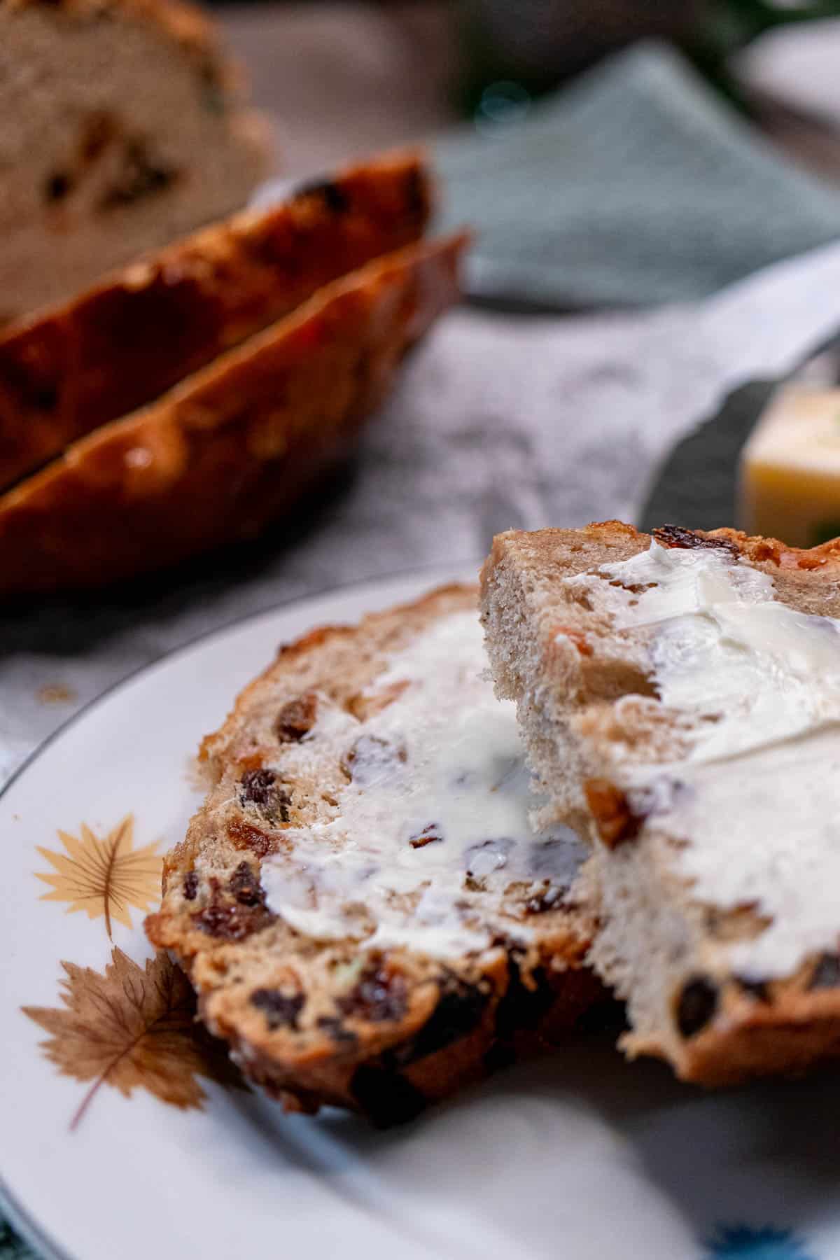 Sliced Irish barmbrack served with Irish butter.