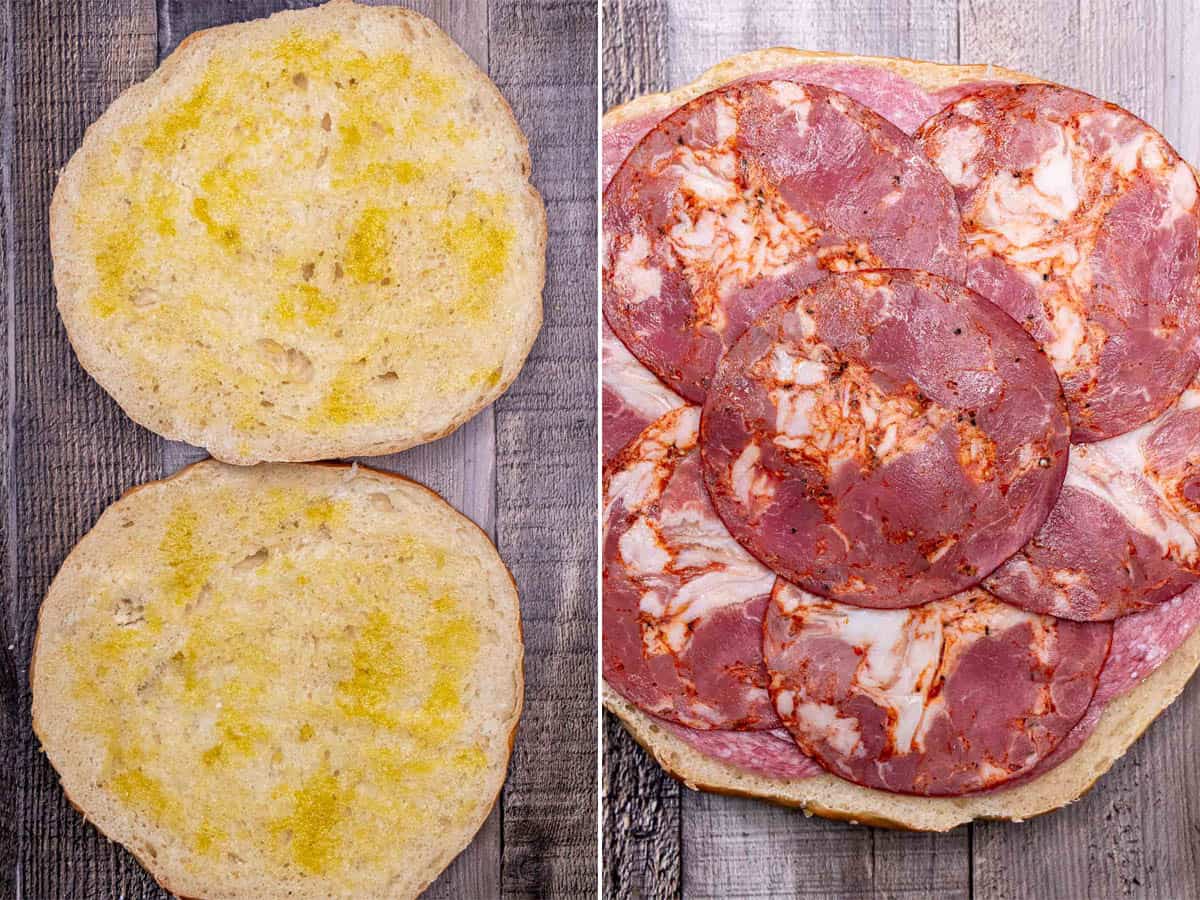 Brushing olive oil onto the cut sides of muffuletta bread, then stacking with meats.