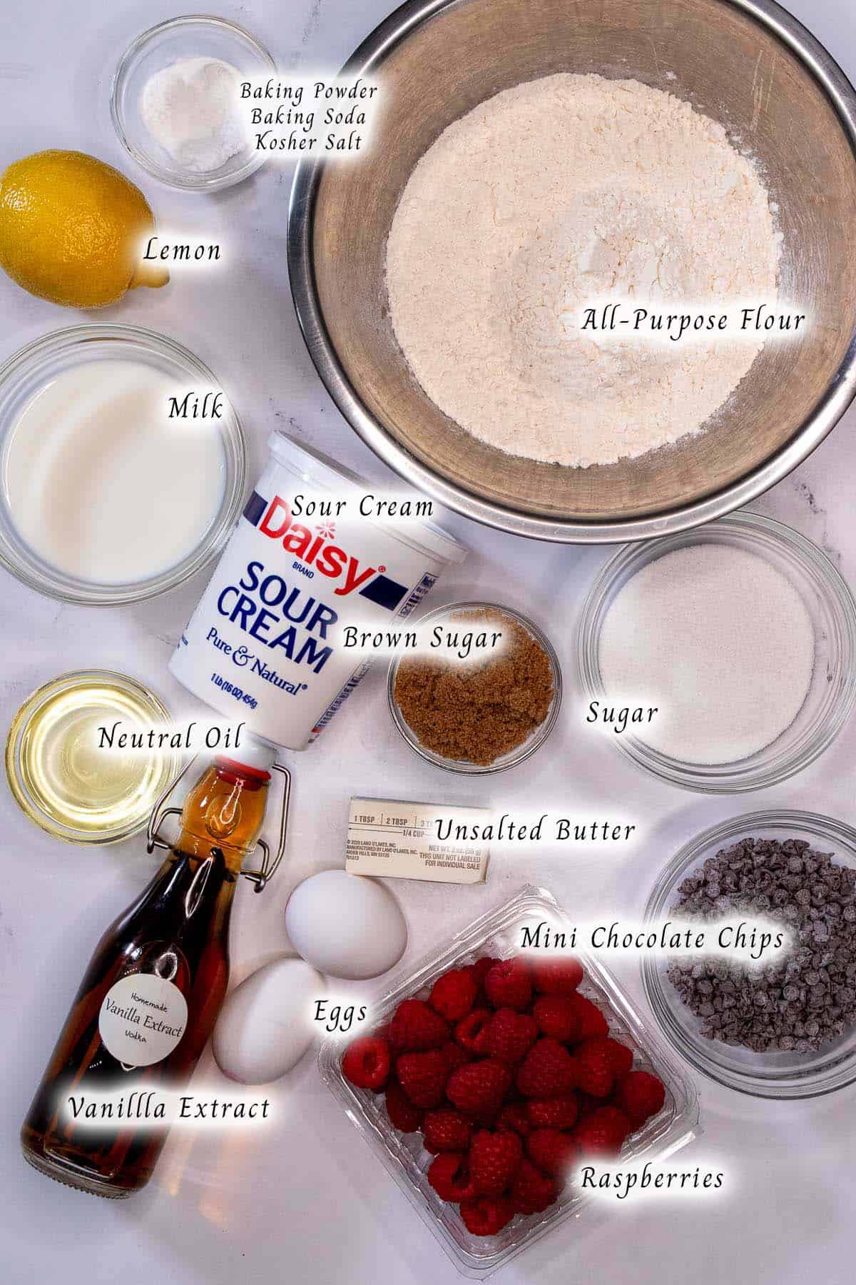 Ingredients for making raspberry chocolate chip muffins.