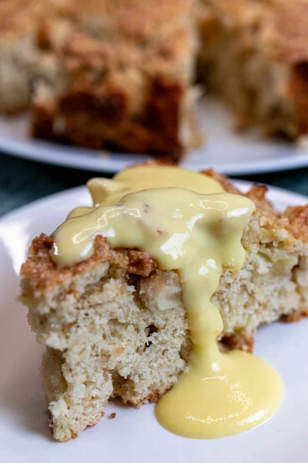 A slice of Kerry apple pie topped with crème anglaise.