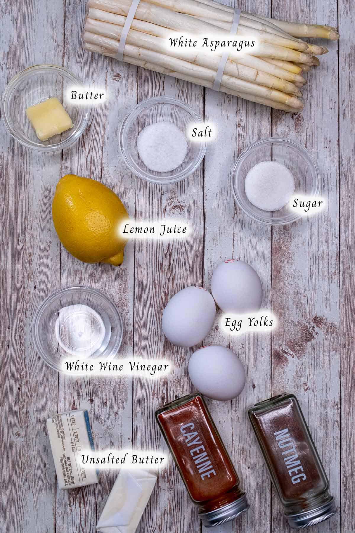 Ingredients for cooking white asparagus and a hollandaise sauce.