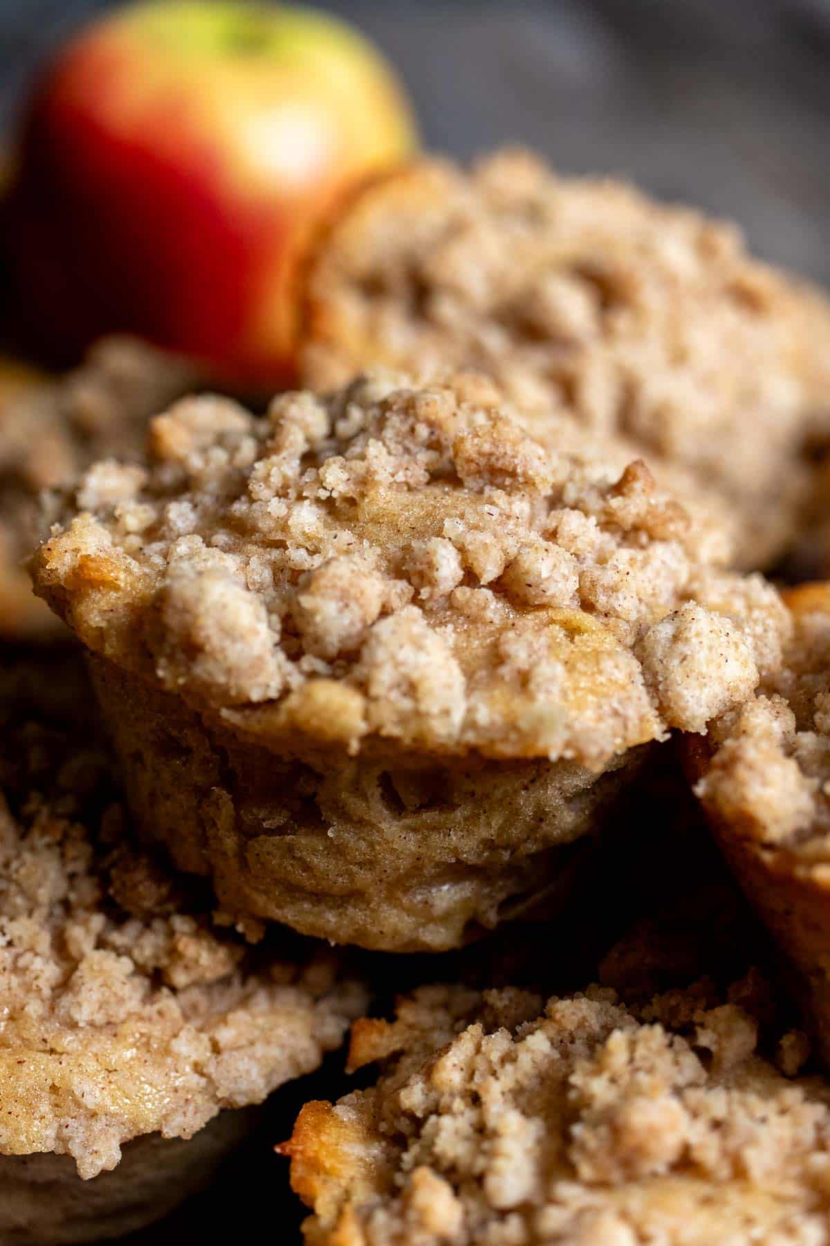 A stack of spiced apple muffins on a plate.