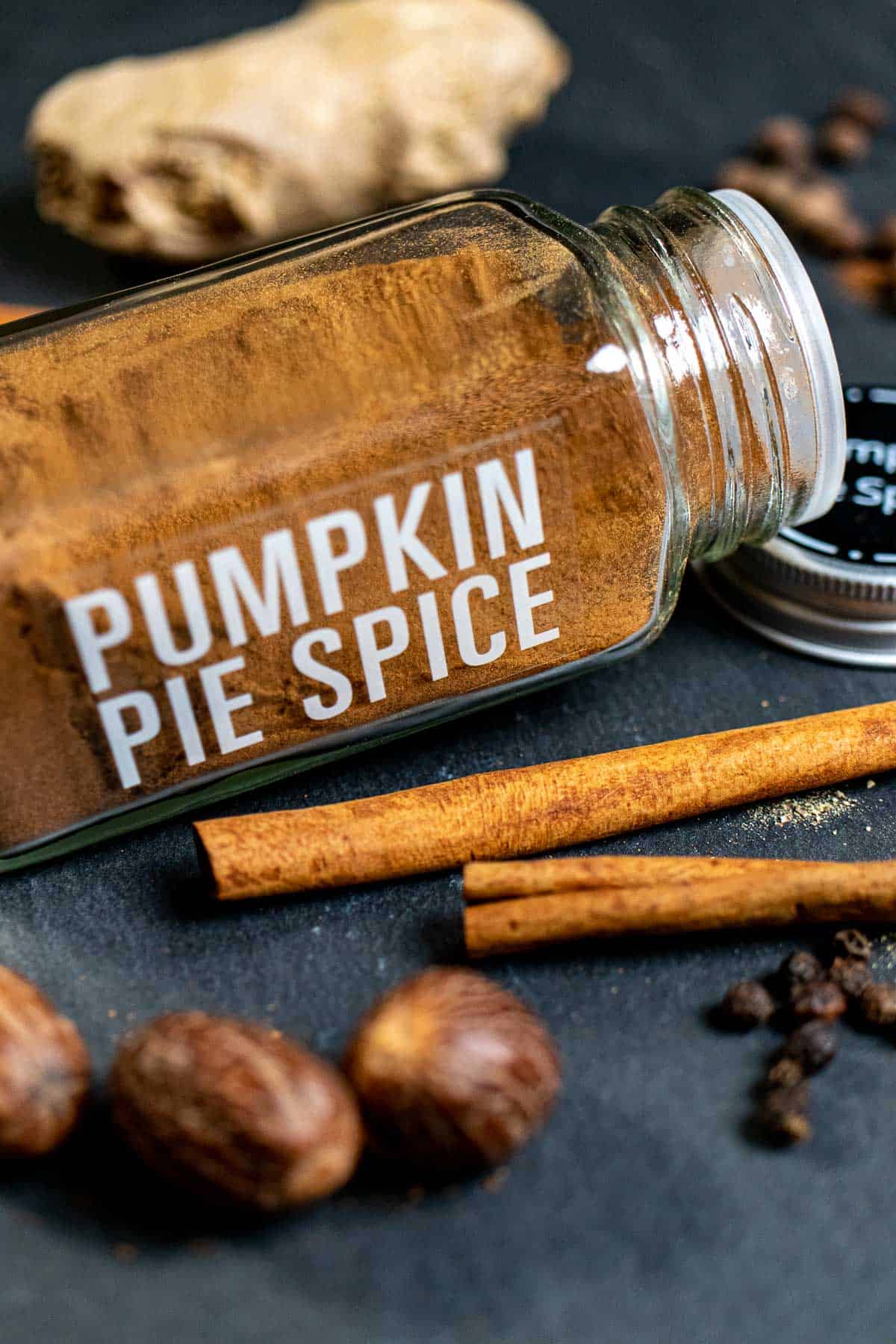 A spice jar filled and labeled with pumpkin pie spice.