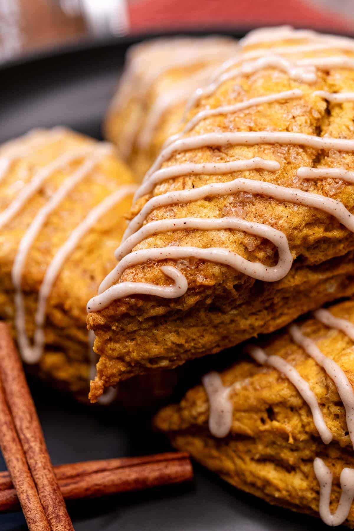 A pumpkin scone drizzled with maple cinnamon glaze.